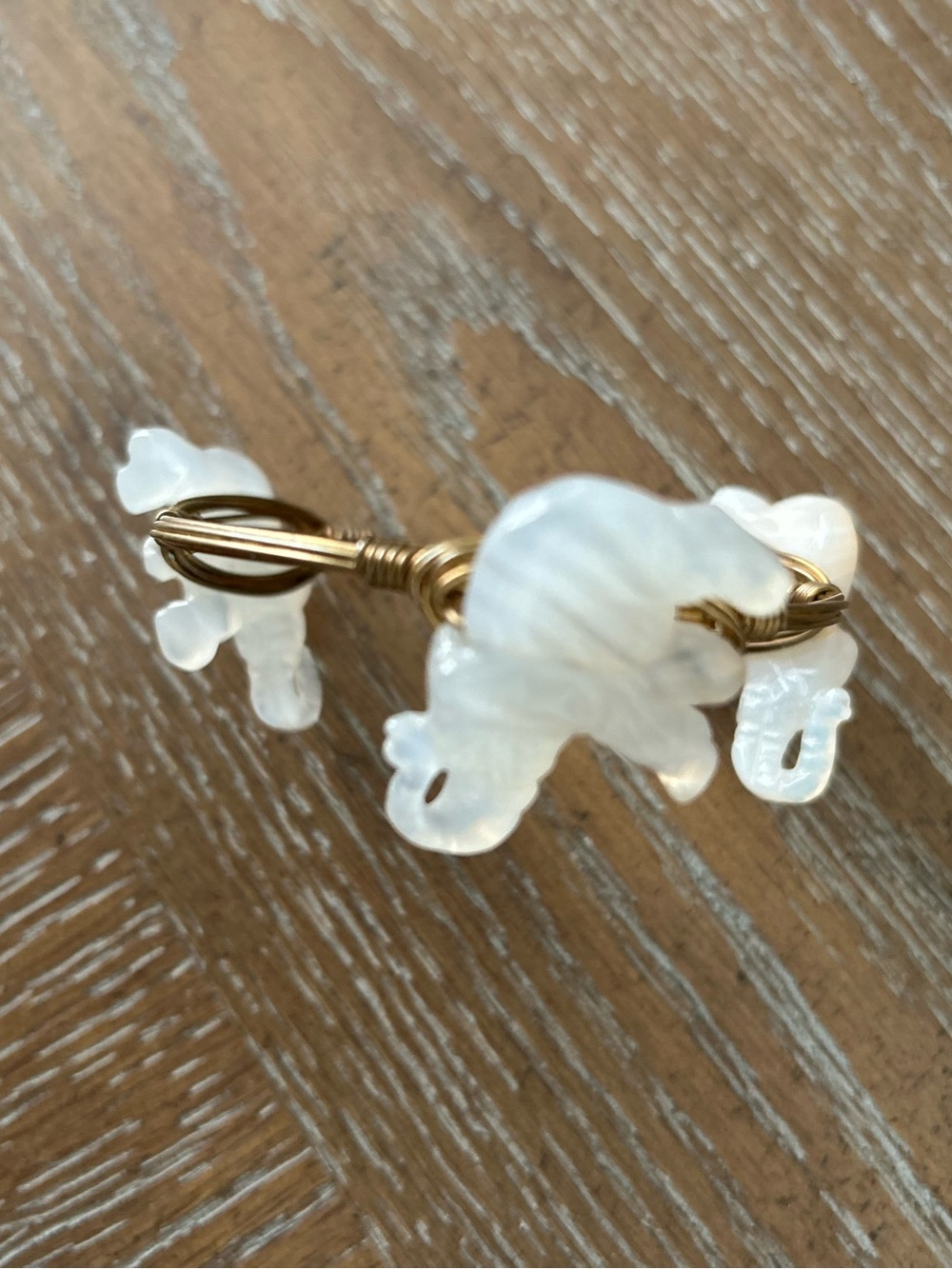 Bourbon and Bow ties Gold-Tone Wire Bracelet with Off-White Stone Elephants